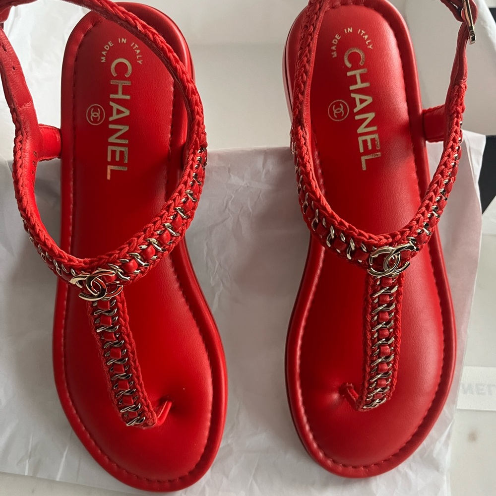 Chanel red thong sandals.